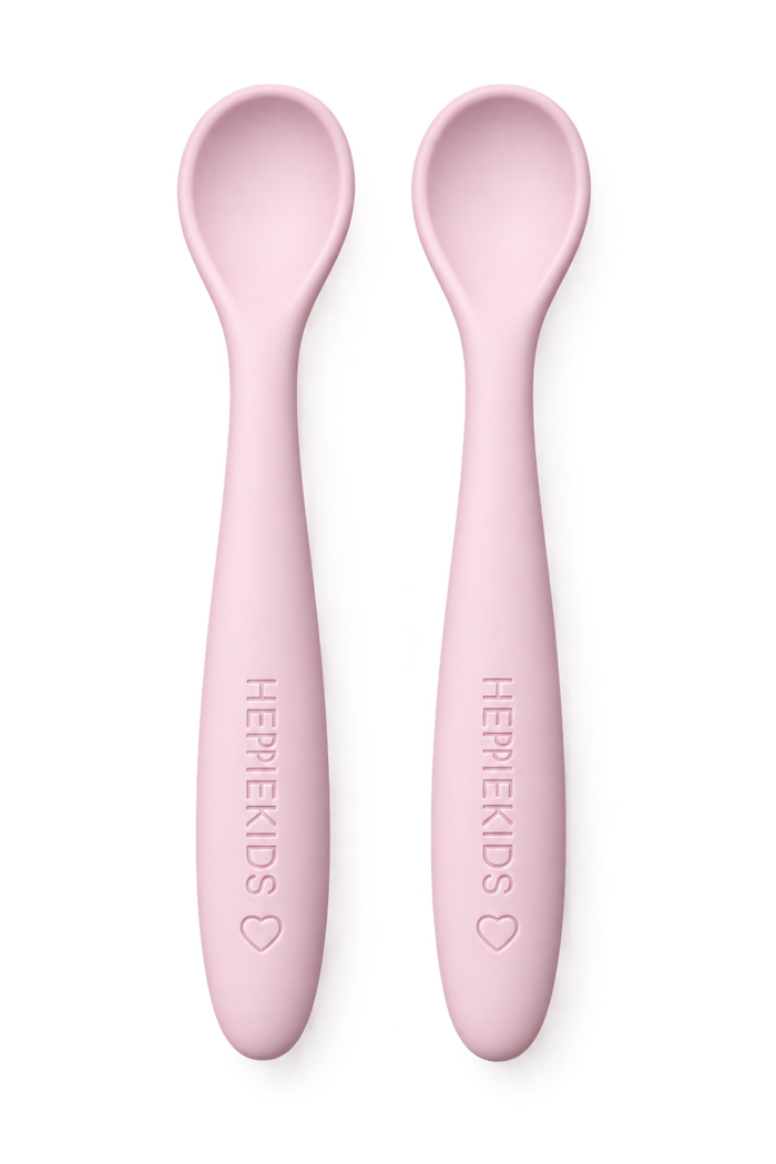 Twee roze siliconen babylepels van HeppieKids